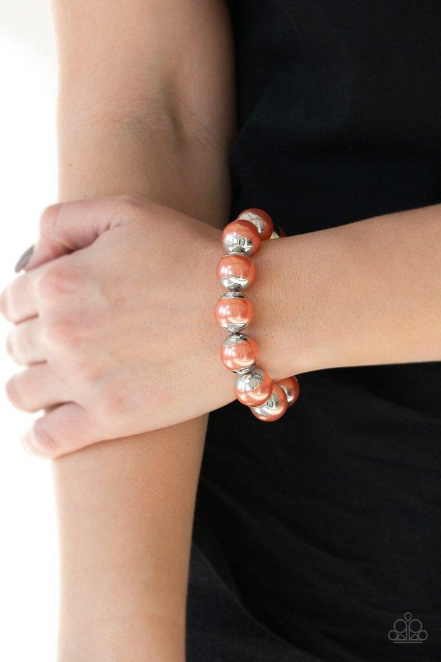 One Woman Shoe Stopper orange bracelet